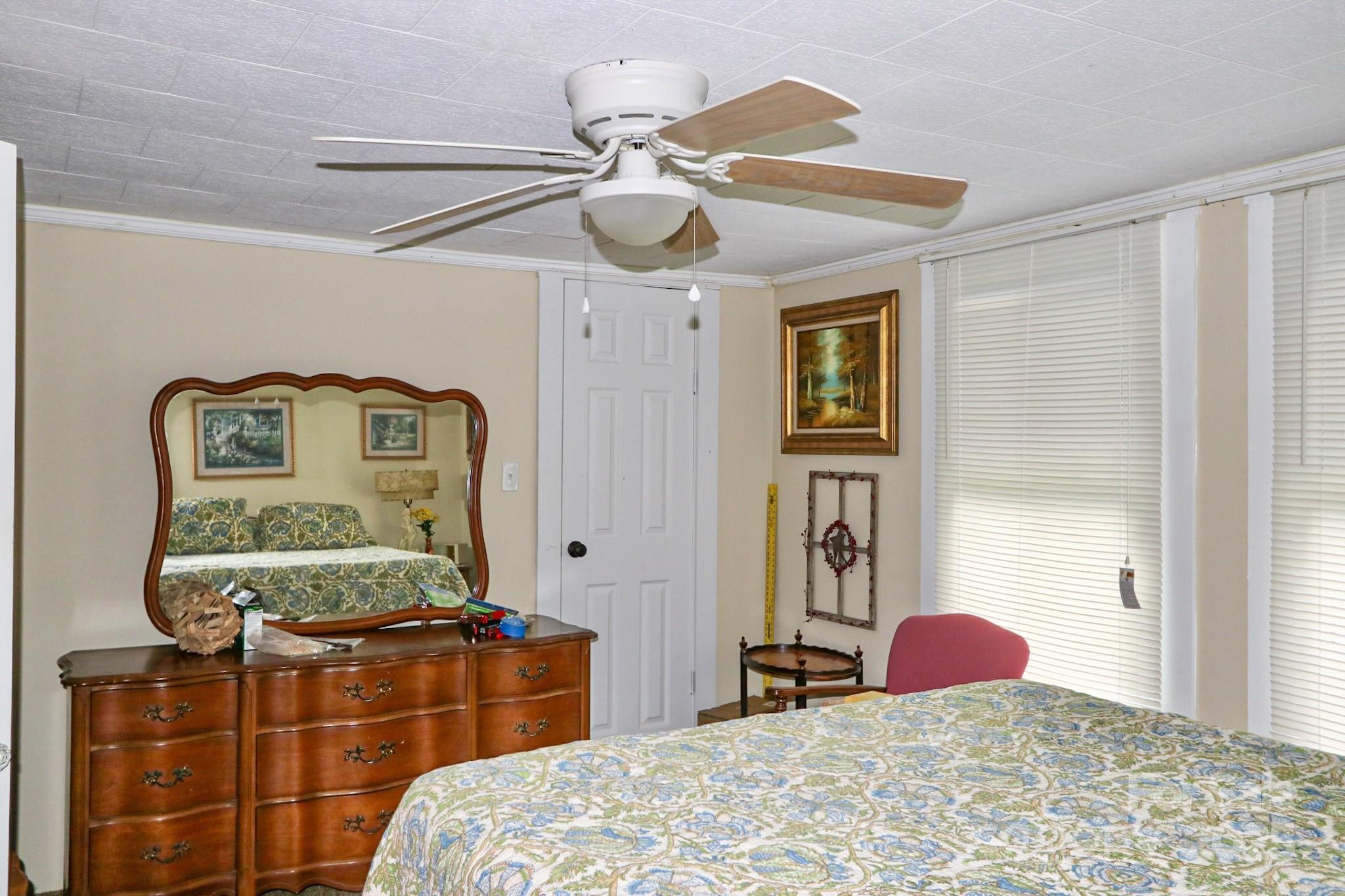 11979 Sparta Road McGrady, NC 28649 - Photo 26 of 48 a bedroom with bed and cabinets