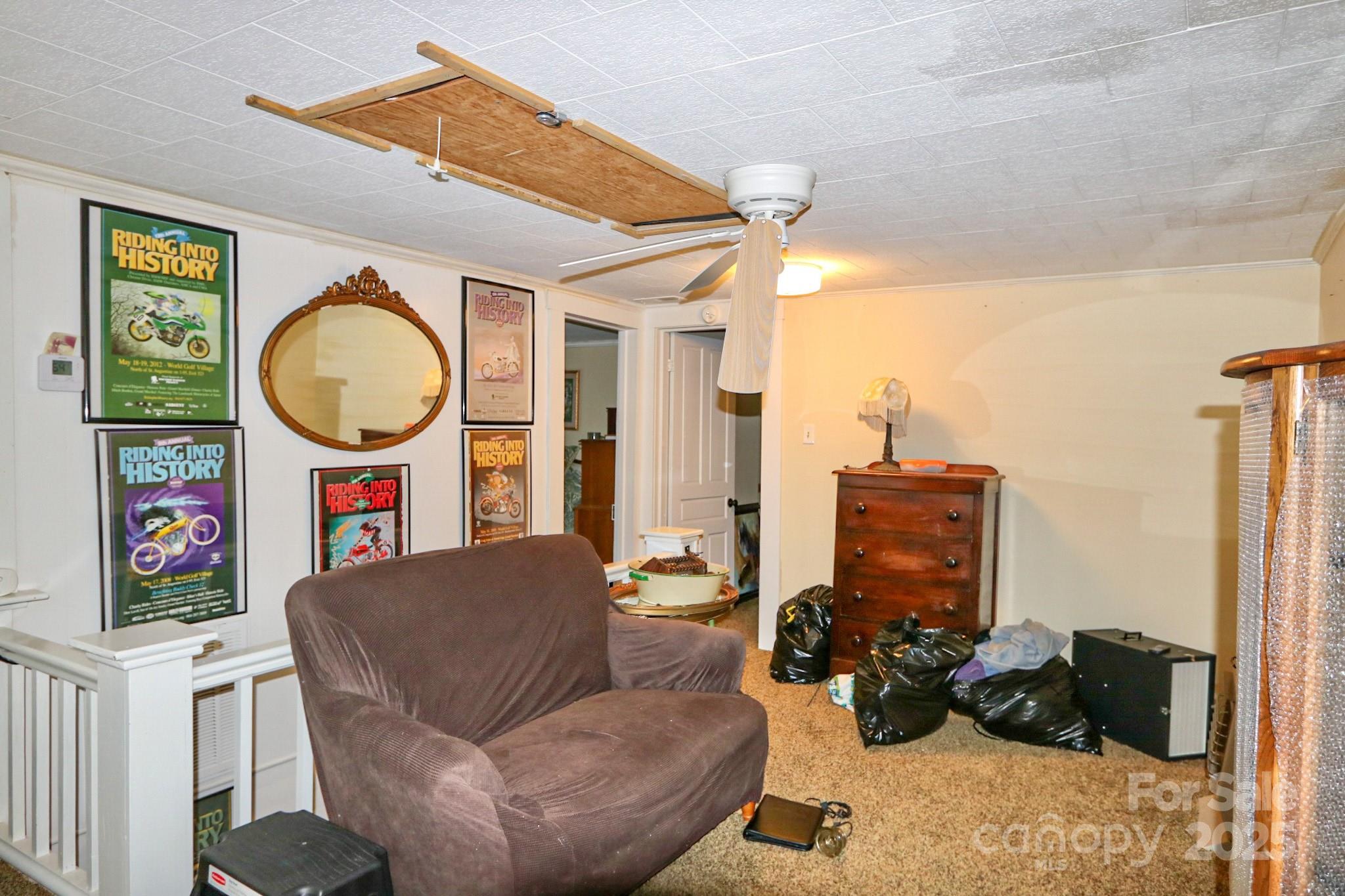 11979 Sparta Road McGrady, NC 28649 - Photo 28 of 48 a living room with furniture a flat screen tv and a floor to ceiling window