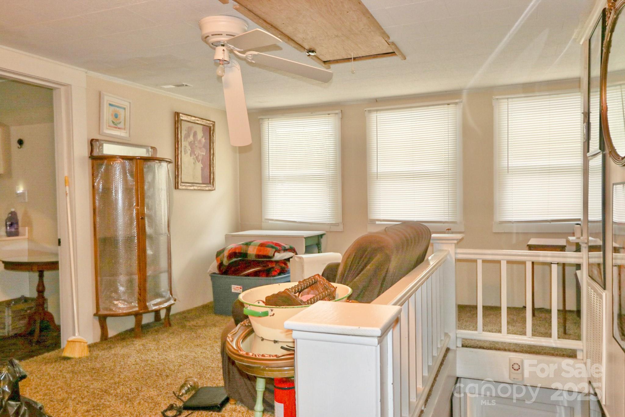 11979 Sparta Road McGrady, NC 28649 - Photo 29 of 48 a living room with furniture a flat screen tv and a window