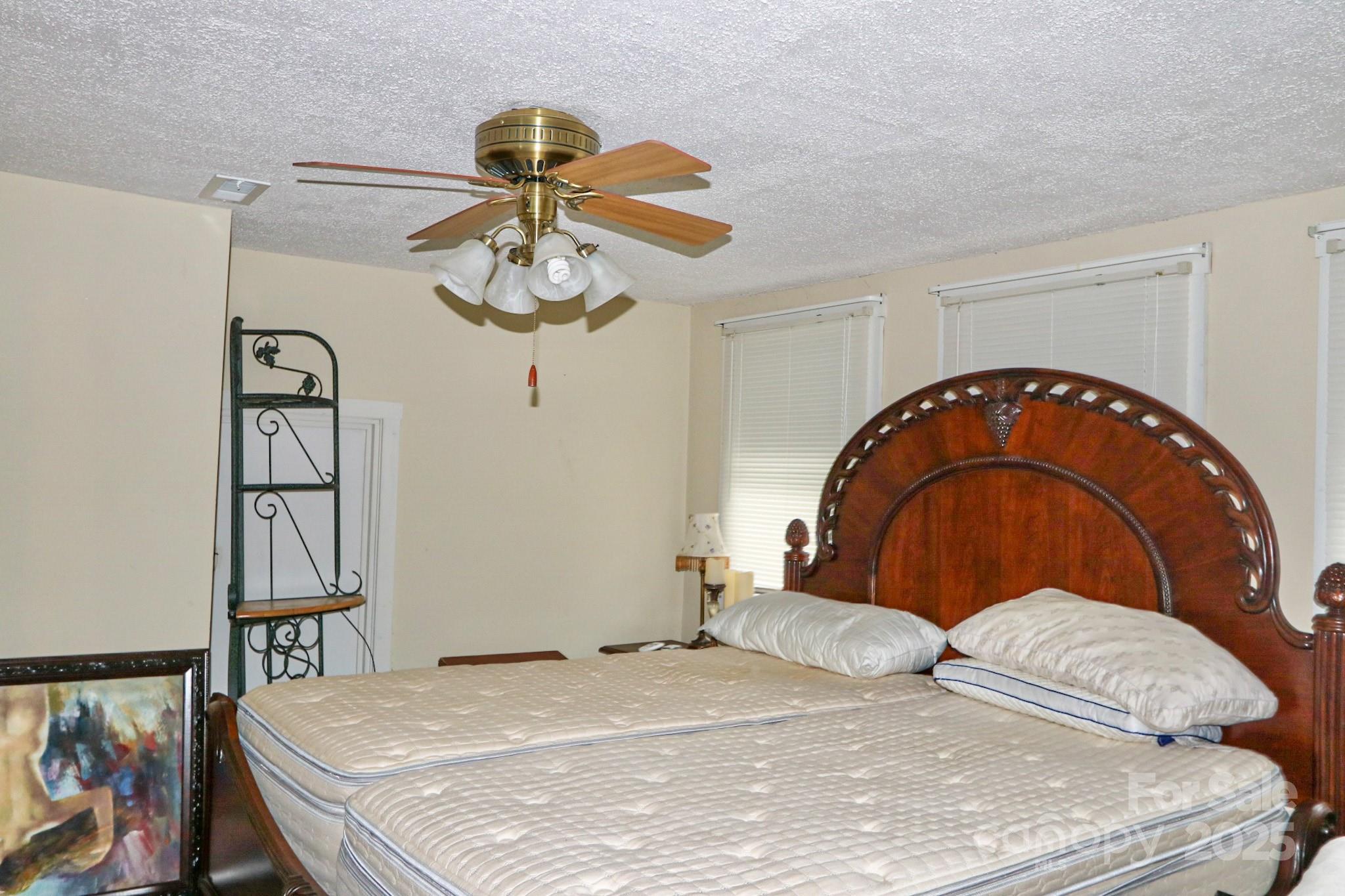 11979 Sparta Road McGrady, NC 28649 - Photo 31 of 48 a bedroom with a bed and dresser