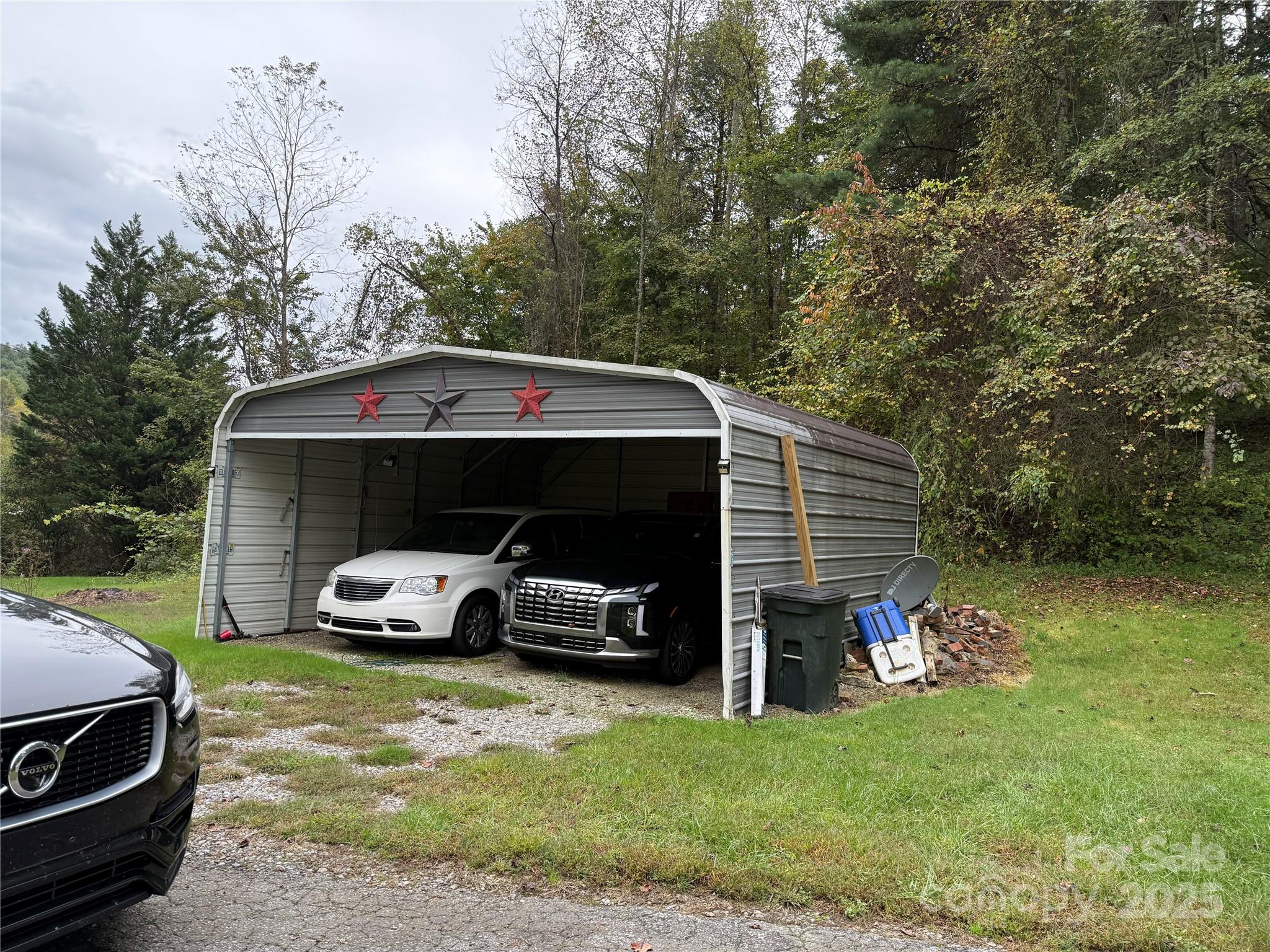 11979 Sparta Road McGrady, NC 28649 - Photo 37 of 48 a car parked in front of a house