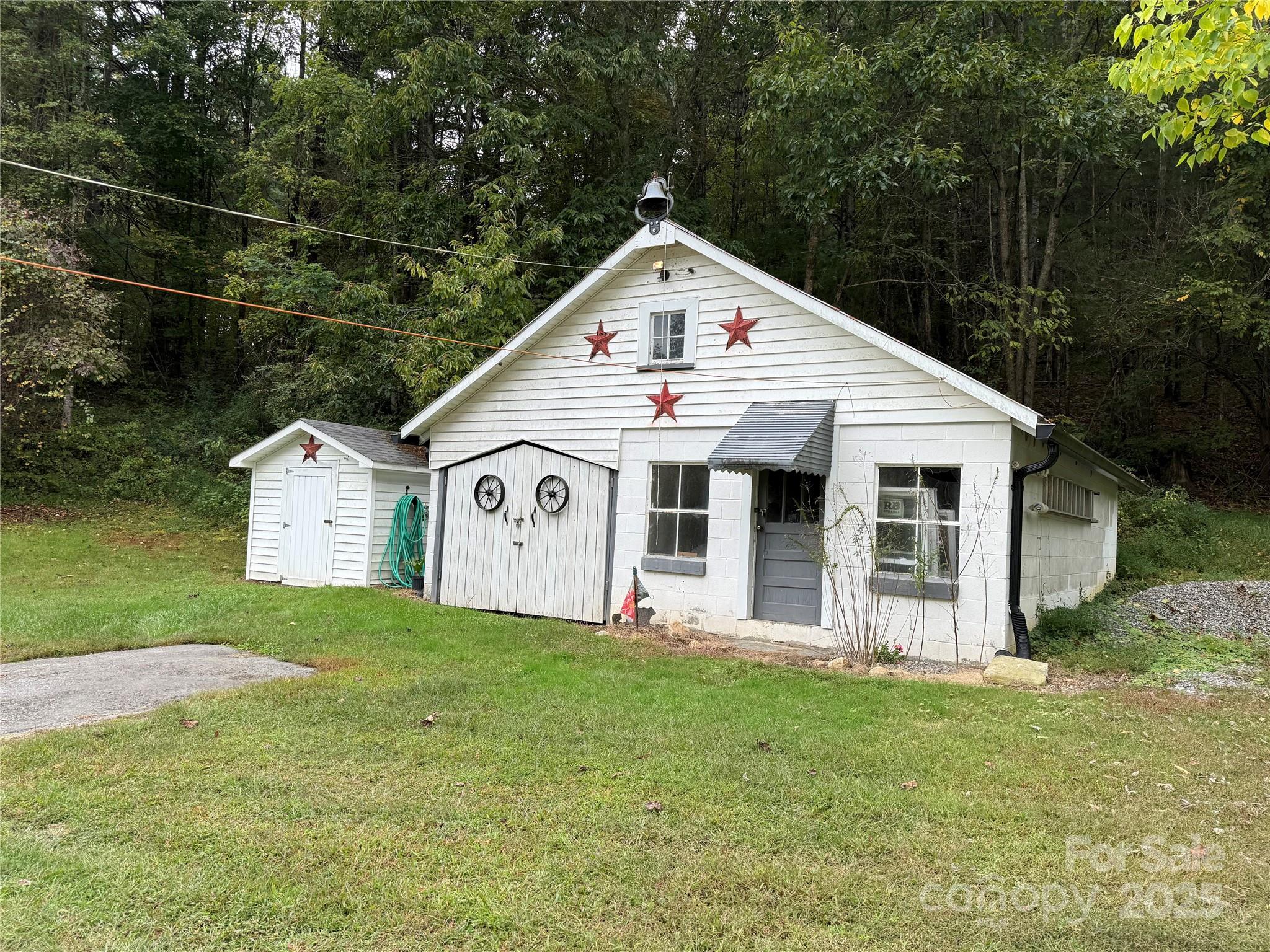 11979 Sparta Road McGrady, NC 28649 - Photo 38 of 48 a view of a house with a yard and garden