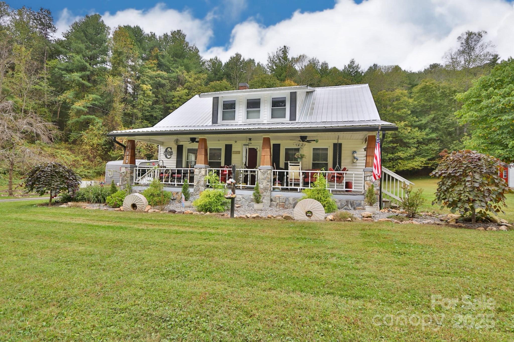 11979 Sparta Road McGrady, NC 28649 - Photo 44 of 48 a view of a house with a big yard and sitting area