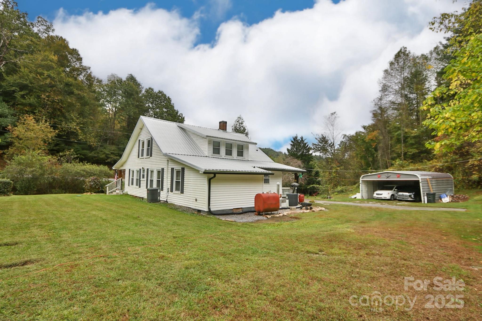 11979 Sparta Road McGrady, NC 28649 - Photo 46 of 48 a white house with a big yard and large trees