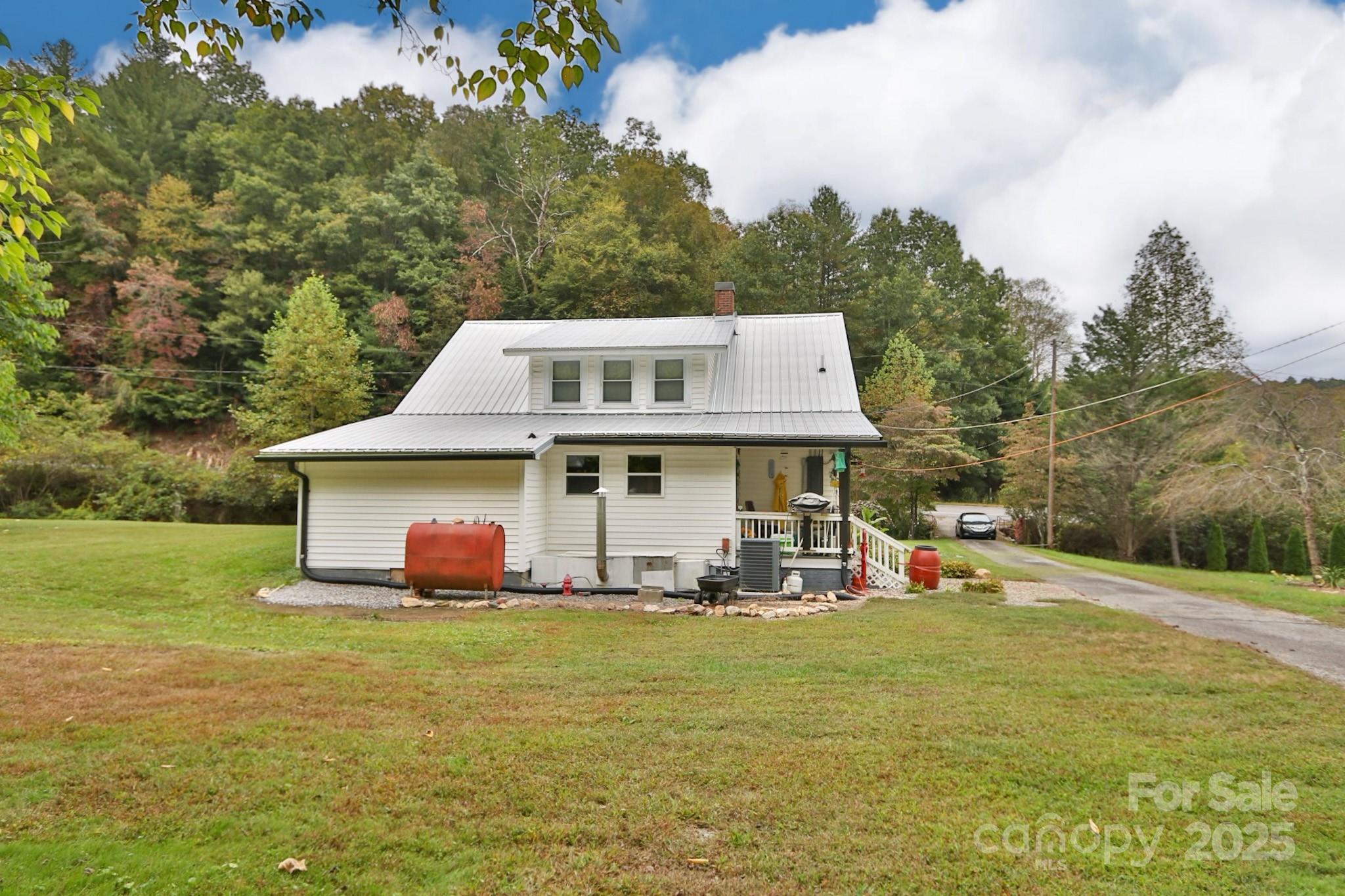 11979 Sparta Road McGrady, NC 28649 - Photo 47 of 48 a front view of a house with garden