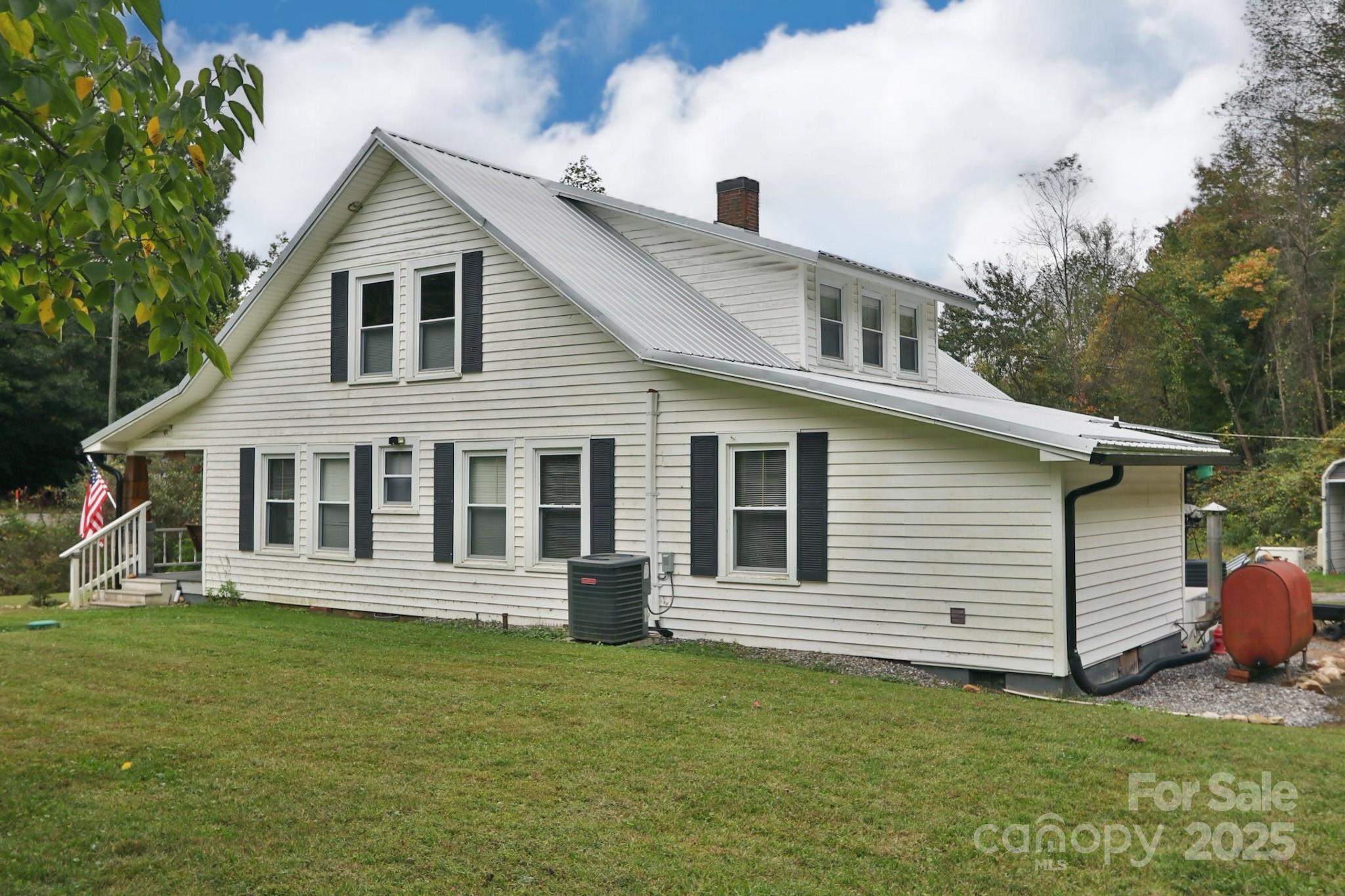11979 Sparta Road McGrady, NC 28649 - Photo 8 of 48 a view of a house with a yard