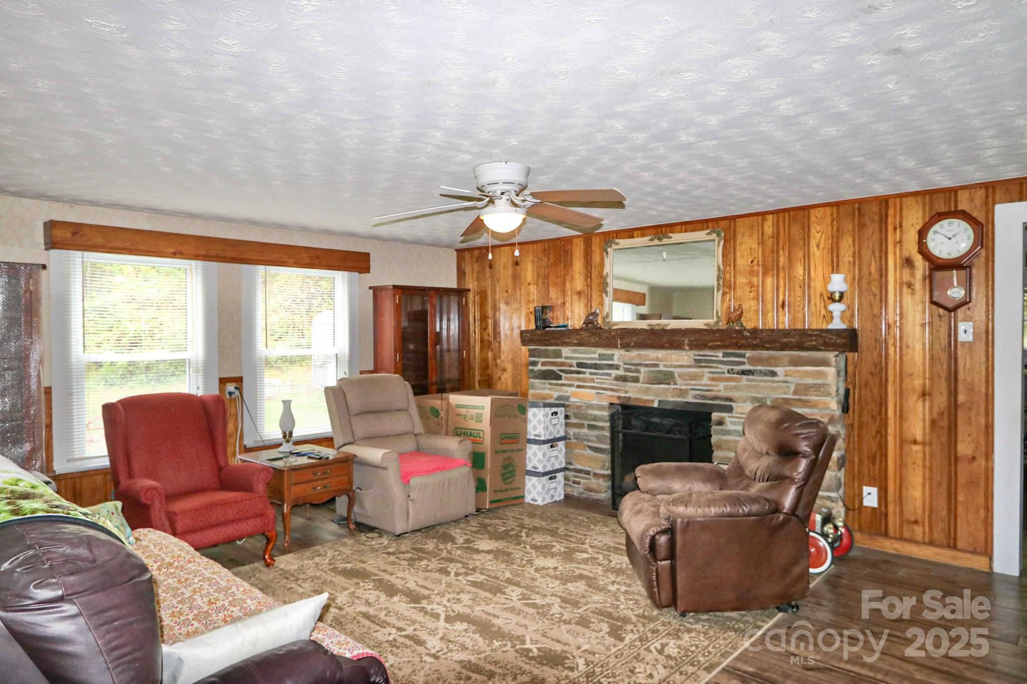 11979 Sparta Road McGrady, NC 28649 - Photo 9 of 48 a living room with furniture a fireplace and a large window
