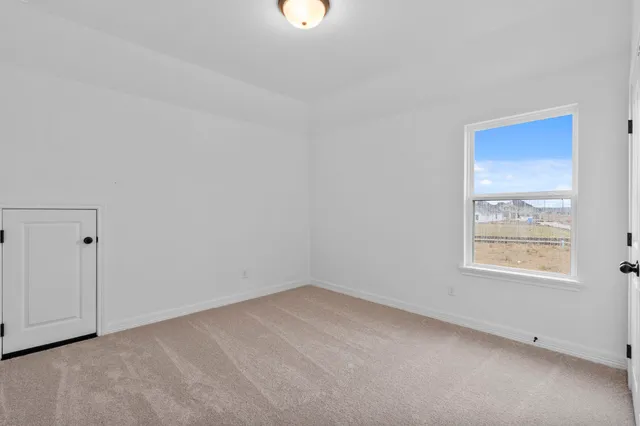 a view of a room that has a window in it