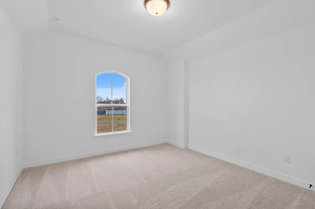 an aerial view of a house with a ocean view