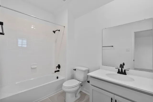 a bathroom with a sink a toilet and a tub