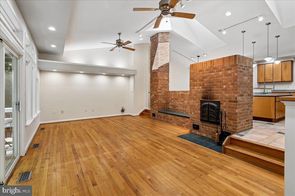 3633 Patuxent River Road Davidsonville, MD 21035 - Photo 21 of 85 Custom Fireplace with Heated Bench & Pizza Oven