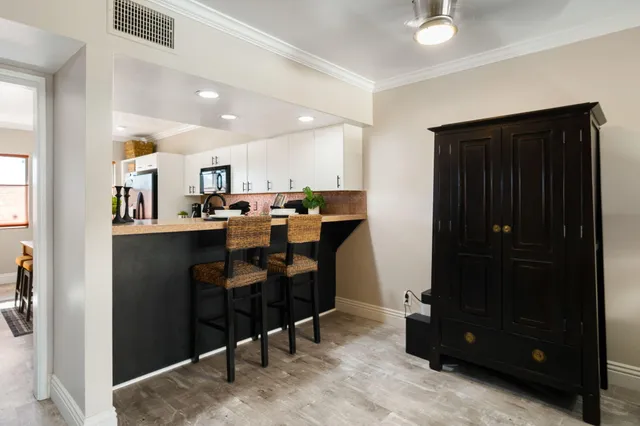 a view of a workspace with furniture