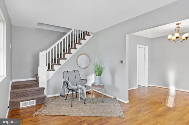 a view of entryway dining room and hall with wooden floor