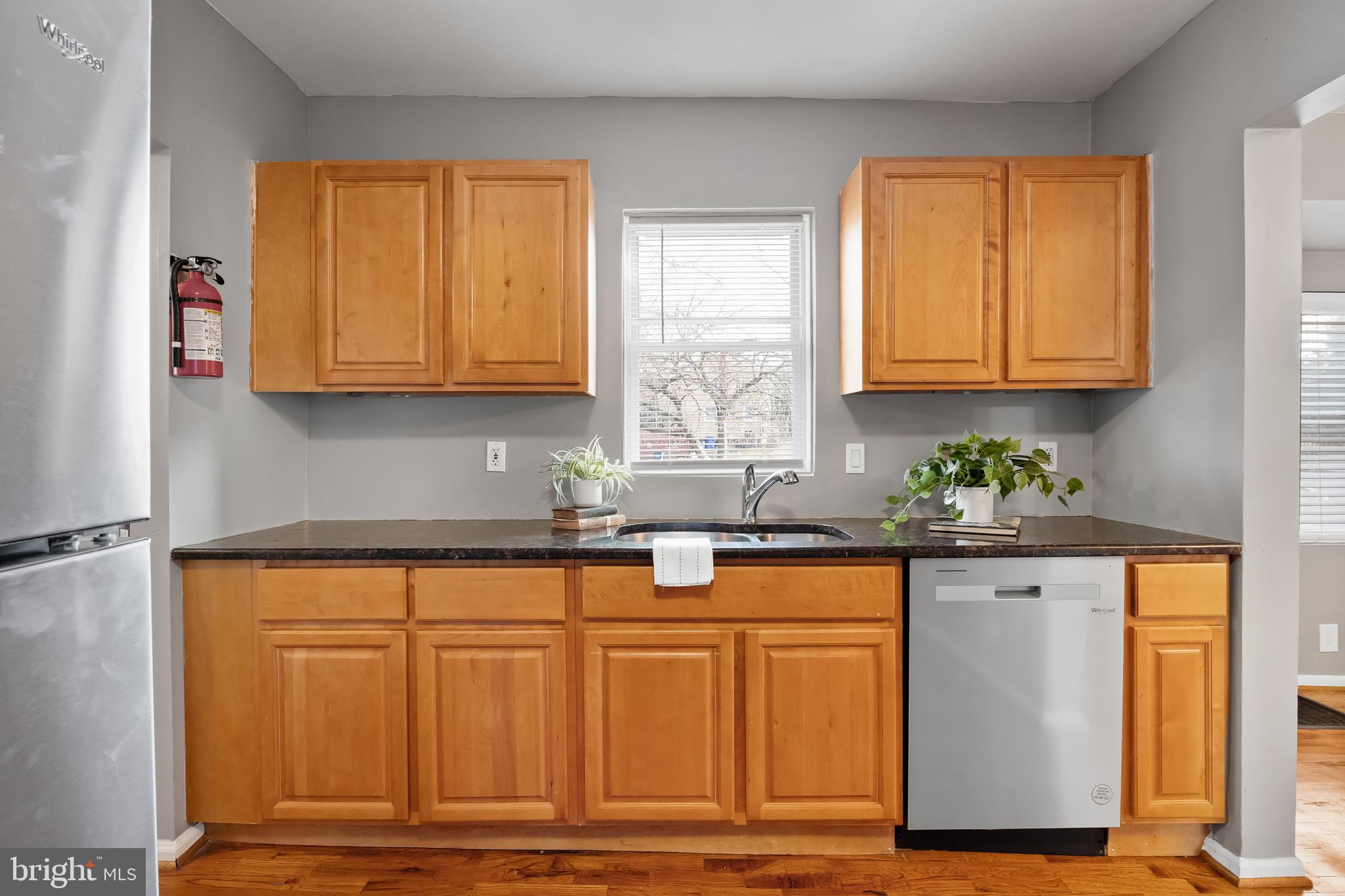 227 Whittier Avenue Moorestown, NJ 08057 - Photo 11 of 19 a kitchen with granite countertop cabinets and window