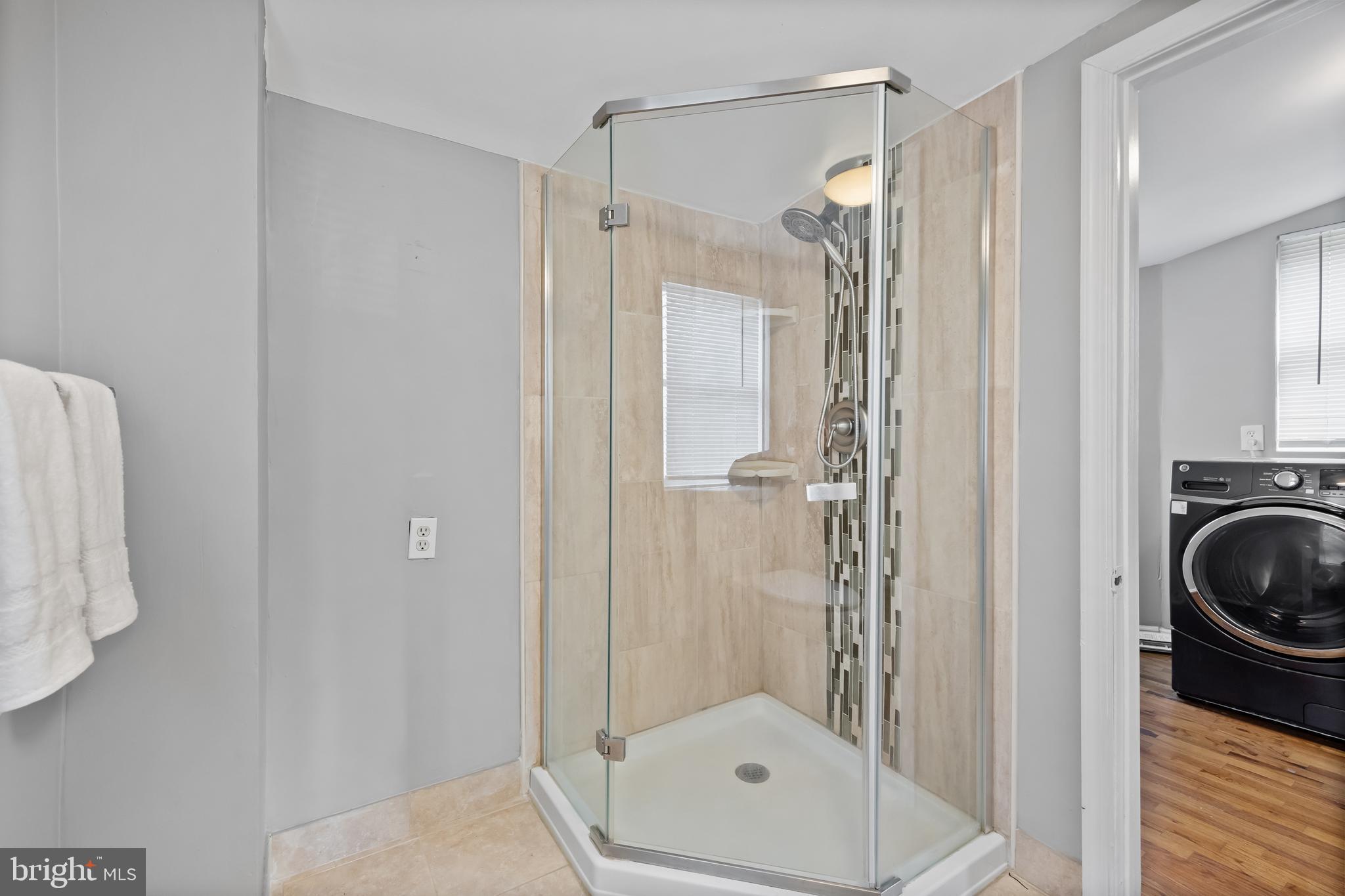 227 Whittier Avenue Moorestown, NJ 08057 - Photo 15 of 19 a bathroom with a tub and a shower
