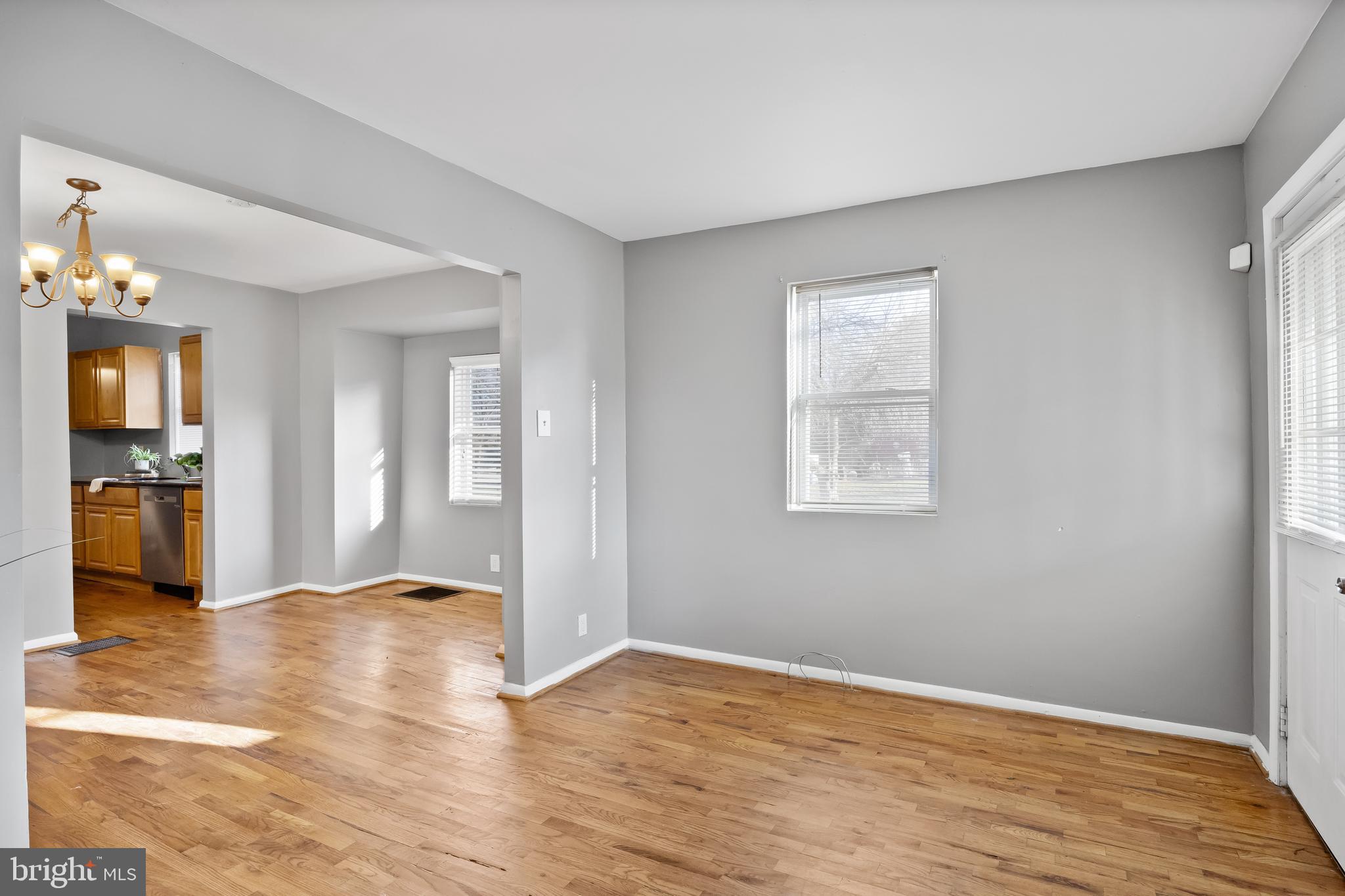 227 Whittier Avenue Moorestown, NJ 08057 - Photo 3 of 19 a view of an empty room with wooden floor and a window