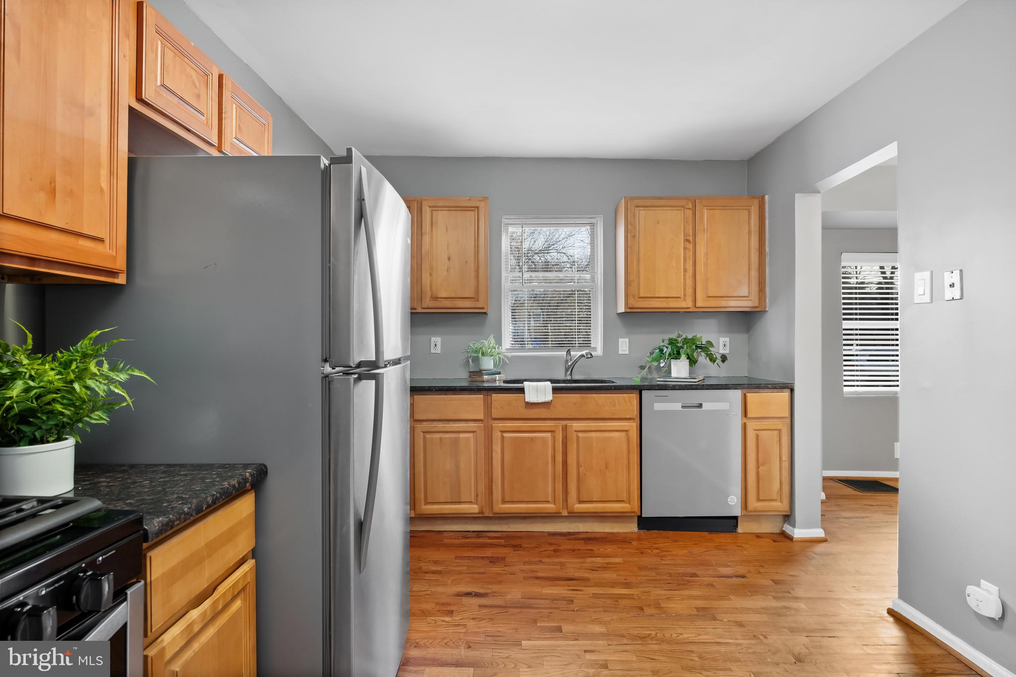 227 Whittier Avenue Moorestown, NJ 08057 - Photo 10 of 19 a kitchen with stainless steel appliances a refrigerator and a stove