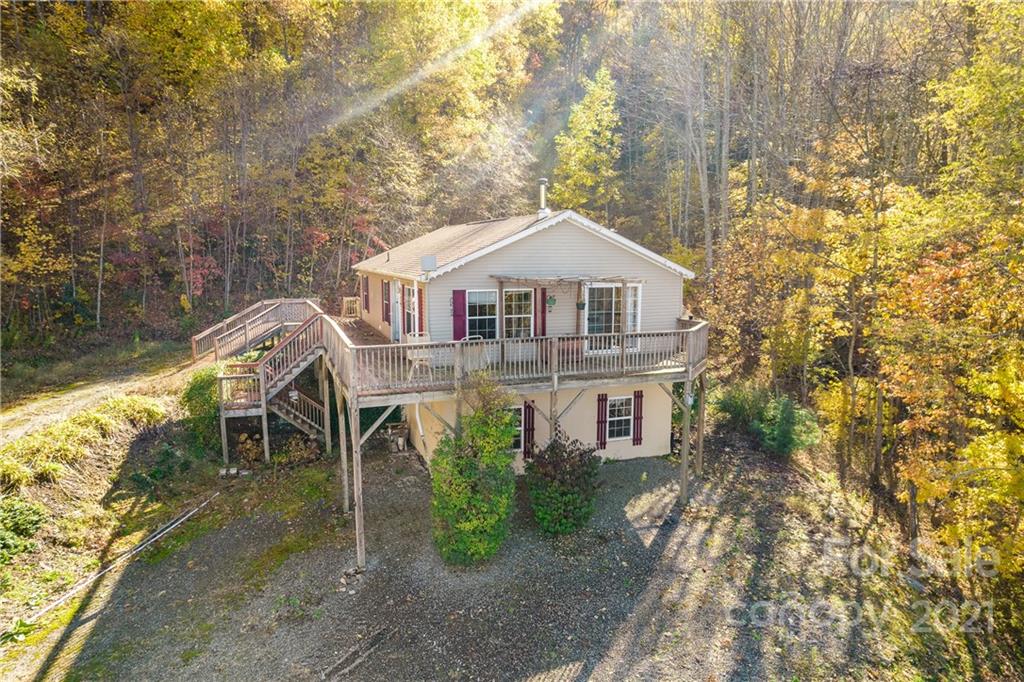 2226 Poplar Cove Road Clyde, NC 28721 - Photo 1 of 21 a front view of a house with a yard