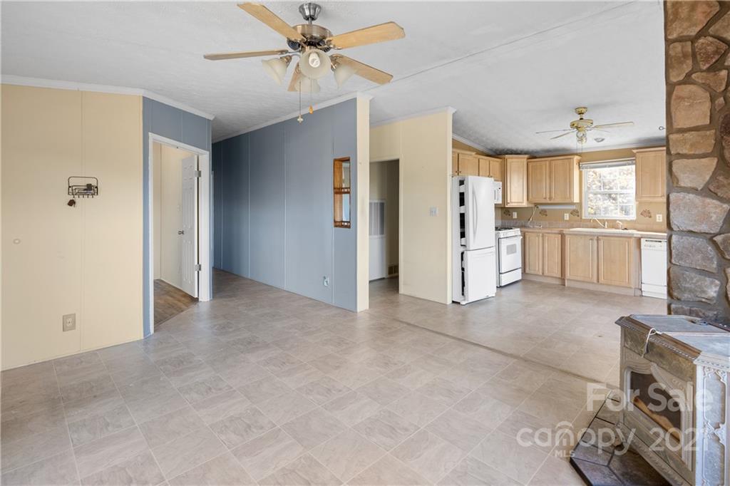 2226 Poplar Cove Road Clyde, NC 28721 - Photo 13 of 21 a view of a kitchen with a sink and a refrigerator