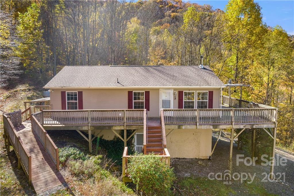 2226 Poplar Cove Road Clyde, NC 28721 - Photo 2 of 21 a view of a house with backyard and sitting area