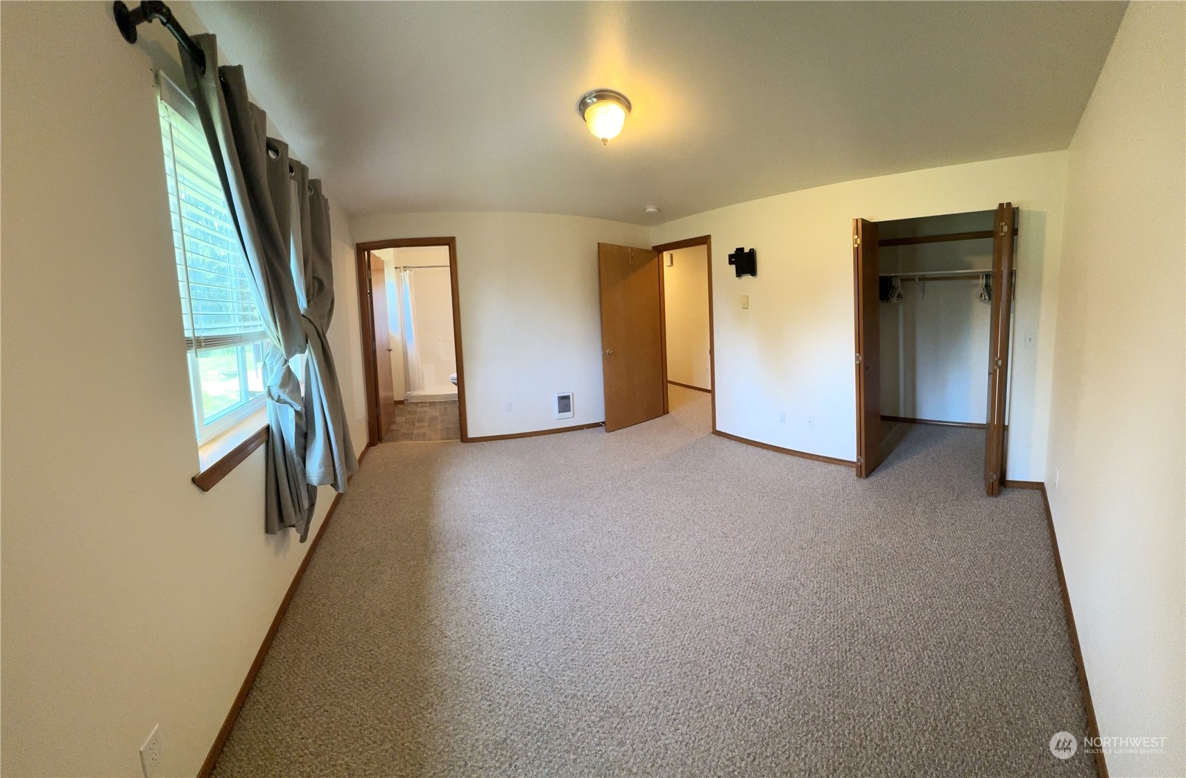 3274 East Harbor Road Langley, WA 98260 - Photo 14 of 21 a view of an empty room with stairs and a window