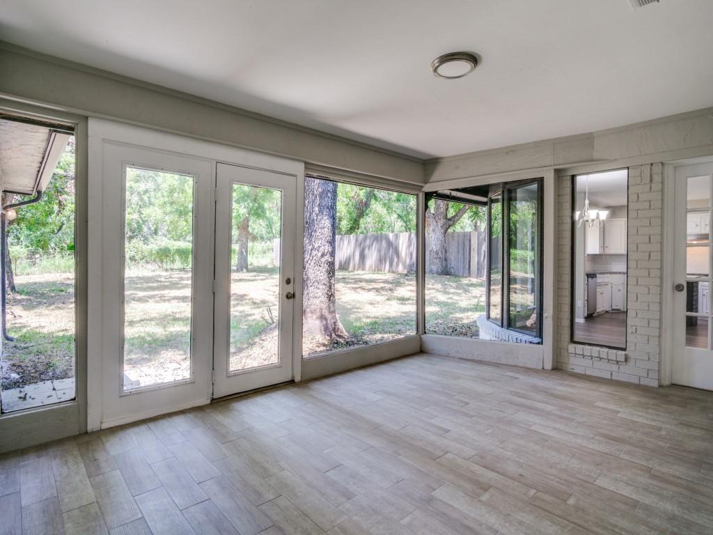 9523 Bellechase Road Granbury, TX 76049 - Photo 11 of 25 a view of an empty room with wooden floor and a window