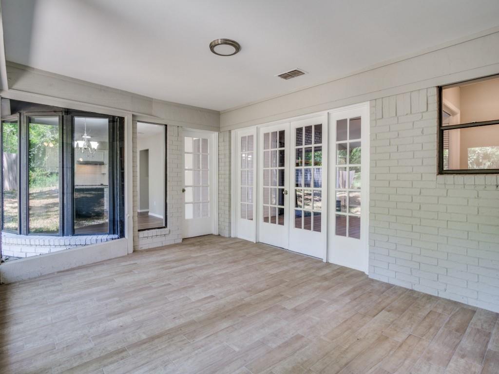 9523 Bellechase Road Granbury, TX 76049 - Photo 12 of 25 a view of an empty room with wooden floor and a window
