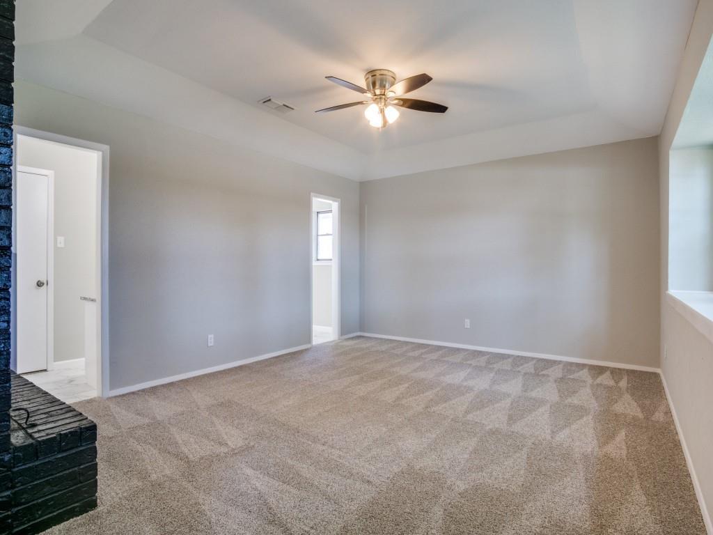 9523 Bellechase Road Granbury, TX 76049 - Photo 13 of 25 a view of an empty room with a chandelier fan