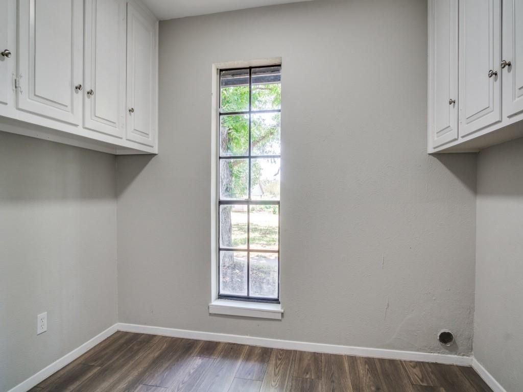 9523 Bellechase Road Granbury, TX 76049 - Photo 18 of 25 a view of empty room with window and cabinet