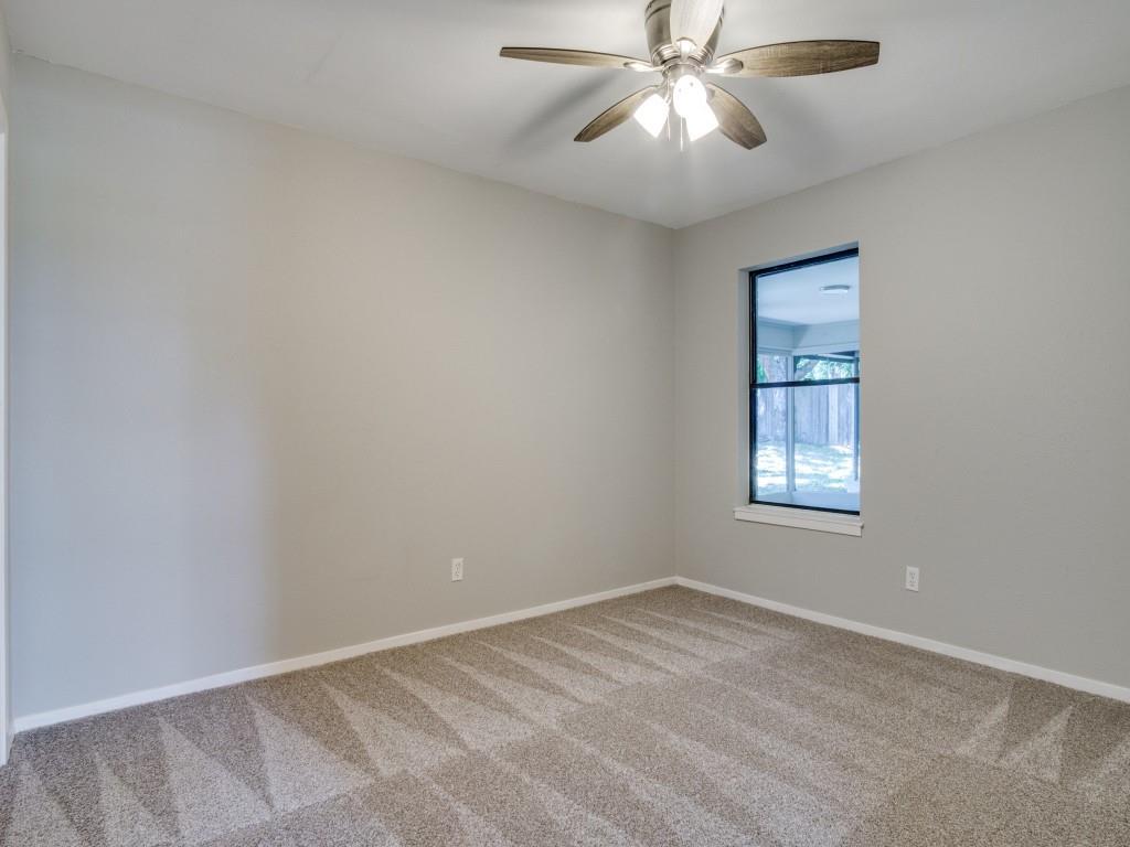 9523 Bellechase Road Granbury, TX 76049 - Photo 19 of 25 an empty room with windows and fan