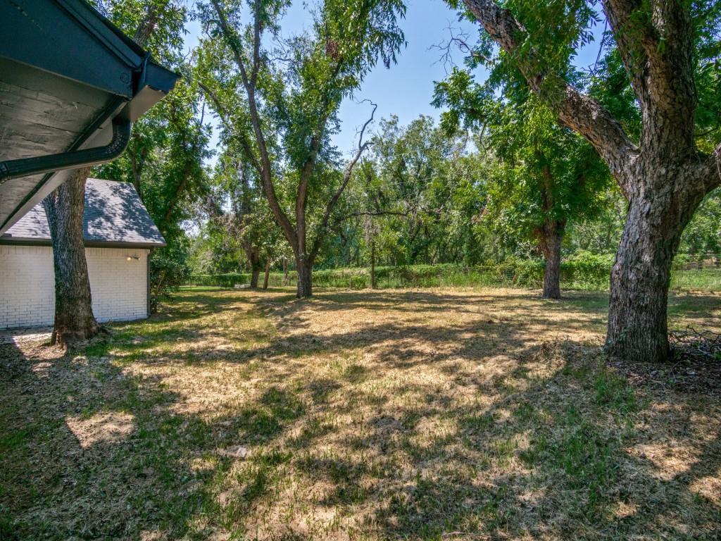 9523 Bellechase Road Granbury, TX 76049 - Photo 25 of 25 a view of outdoor space with deck and tree
