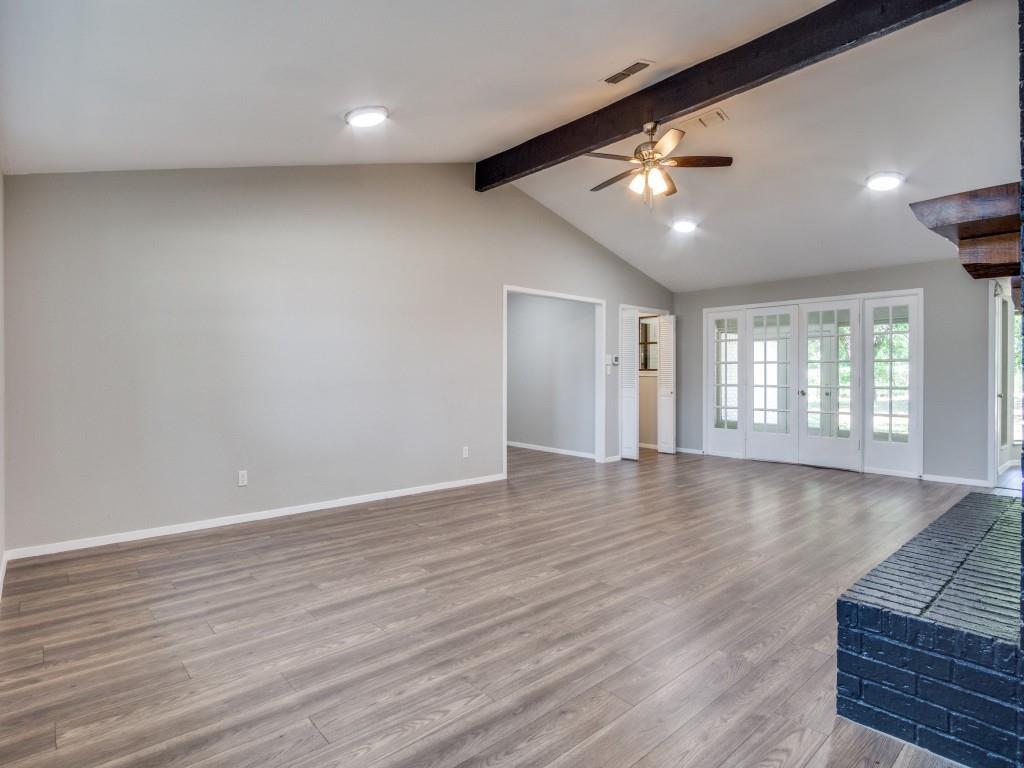9523 Bellechase Road Granbury, TX 76049 - Photo 5 of 25 a view of an empty room with wooden floor and a window