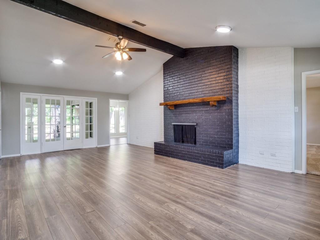 9523 Bellechase Road Granbury, TX 76049 - Photo 6 of 25 a view of an empty room with wooden floor and a window