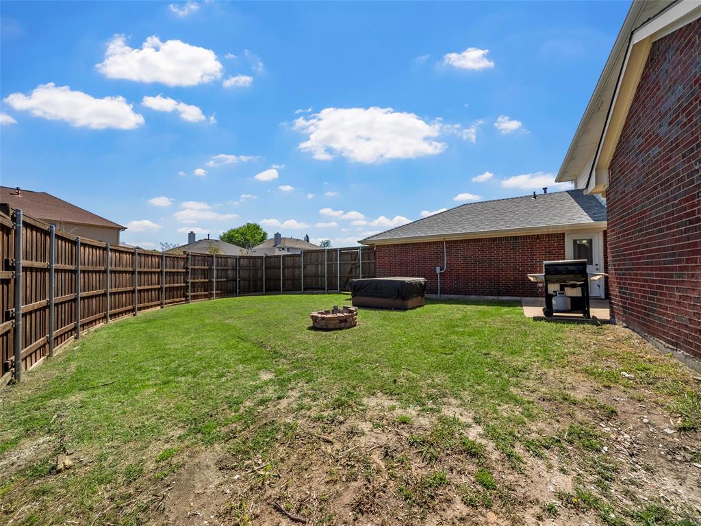 741 Aspen Court Allen, TX 75002 - Photo 6 of 40 Fenced backyard with a fire pit