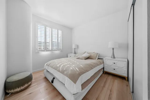 a bedroom with a bed and window