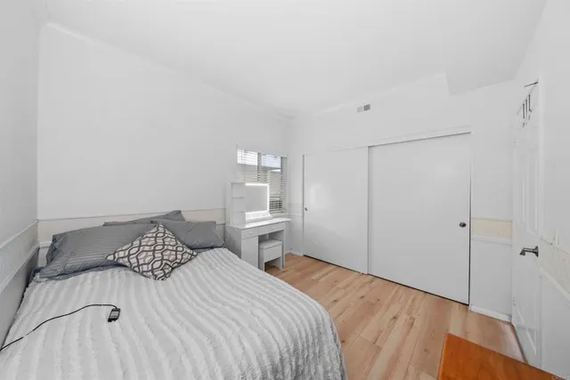 a bathroom with a double vanity sink toilet mirror and shower