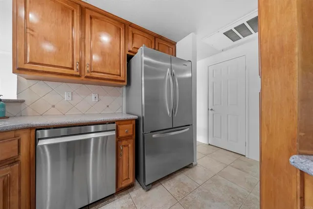 a view of a balcony with wooden floor and fence