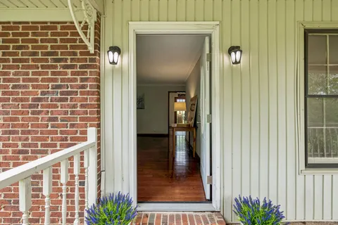 a view of balcony with floor to ceiling window