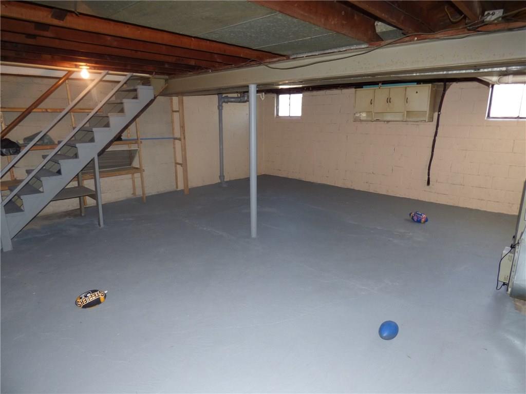 524 Scene Ridge Road Liberty, PA 15133 - Photo 14 of 23 ALternate view of the basement. note the build in shelves for storage