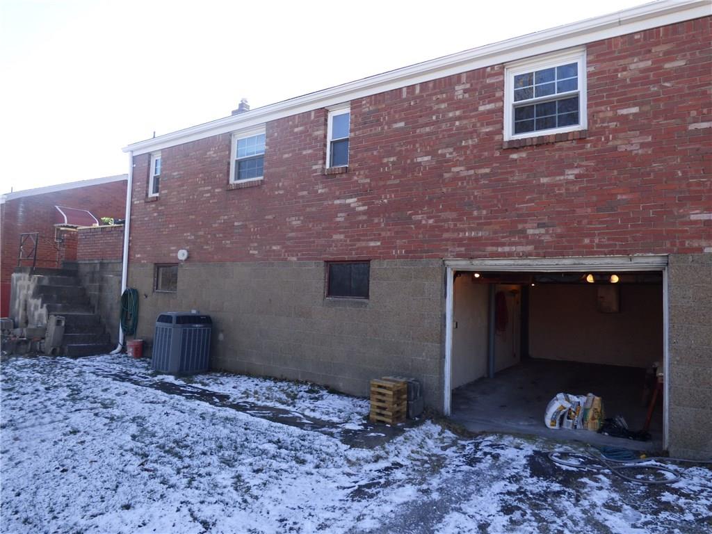 524 Scene Ridge Road Liberty, PA 15133 - Photo 23 of 23 Exterior rear view with garage door open. Note steps down from side porch.