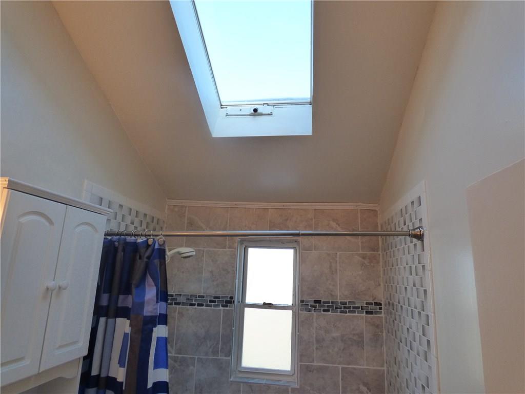 524 Scene Ridge Road Liberty, PA 15133 - Photo 9 of 23 Awesome full bath with sky light and upgraded tile