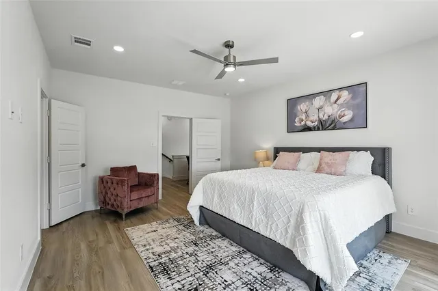 a bedroom with a bed and dresser