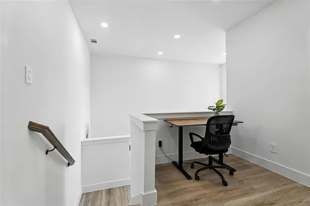 a workspace with furniture and wooden floor