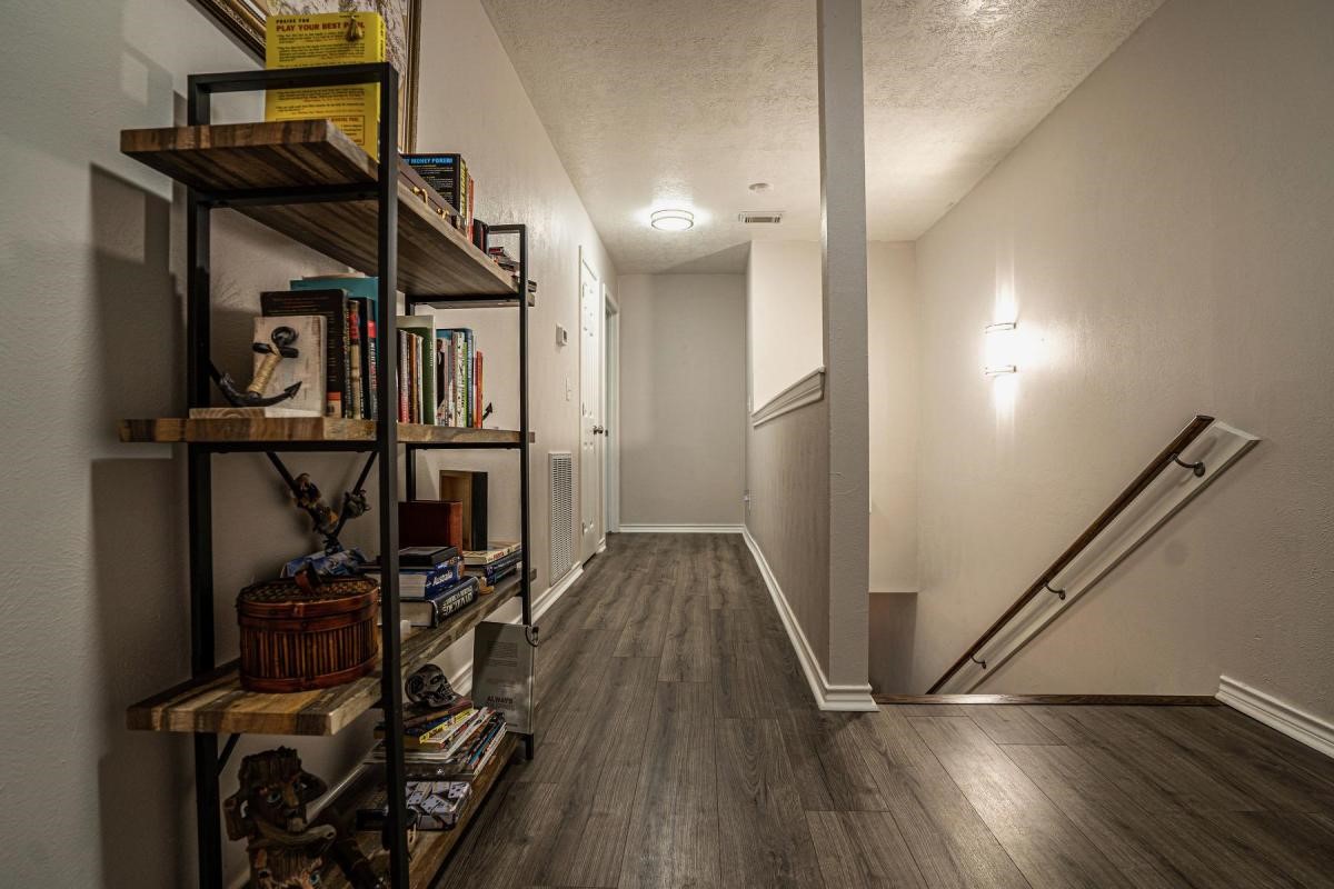 13209 Bluff View Drive Willis, TX 77318 - Photo 12 of 21 a view of a hallway with wooden floor