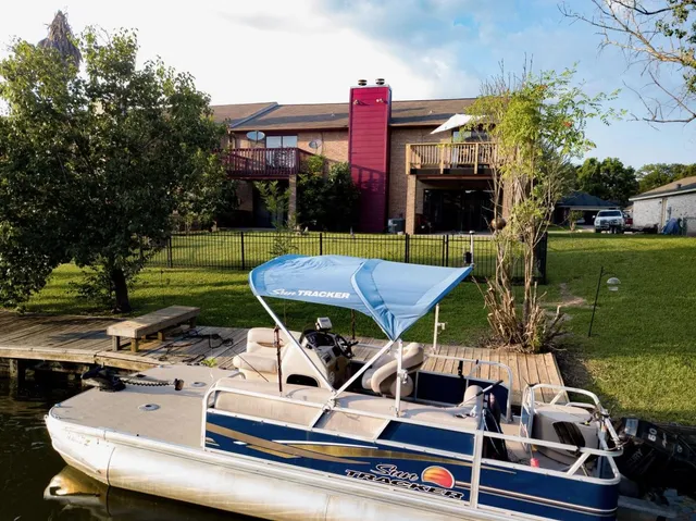 a view of a chairs and table in the patio