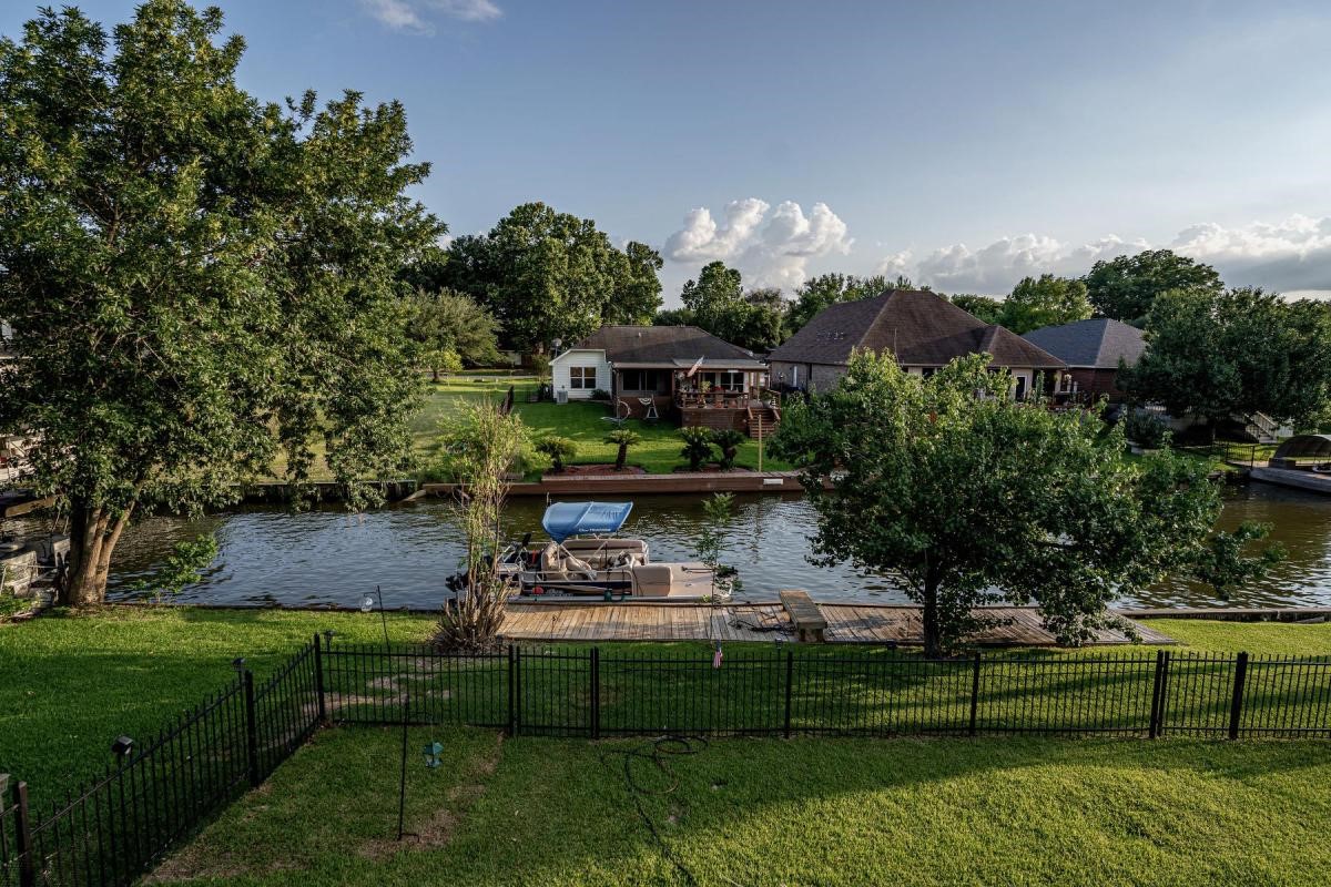 13209 Bluff View Drive Willis, TX 77318 - Photo 4 of 21 a view of house with outdoor space and sitting area