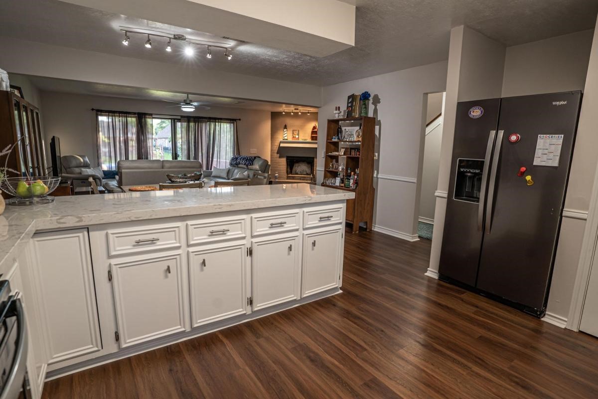 13209 Bluff View Drive Willis, TX 77318 - Photo 10 of 21 a kitchen with a refrigerator and a sink