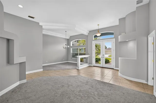 a view of an empty room with a fireplace