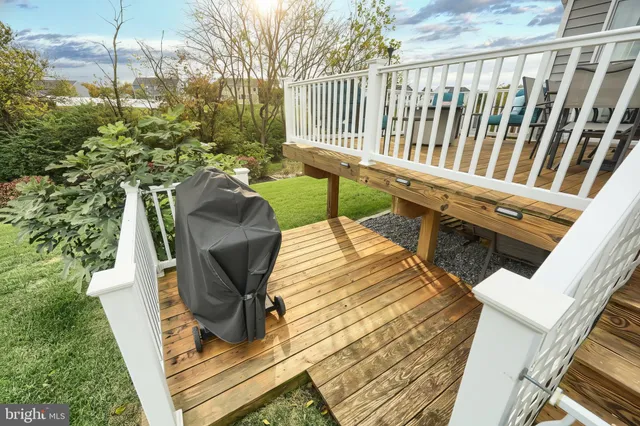 a view of balcony with chairs and wooden fence