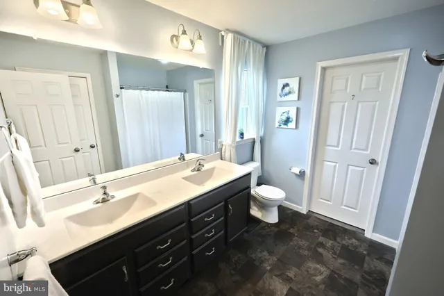 a workspace with furniture window and wooden floor